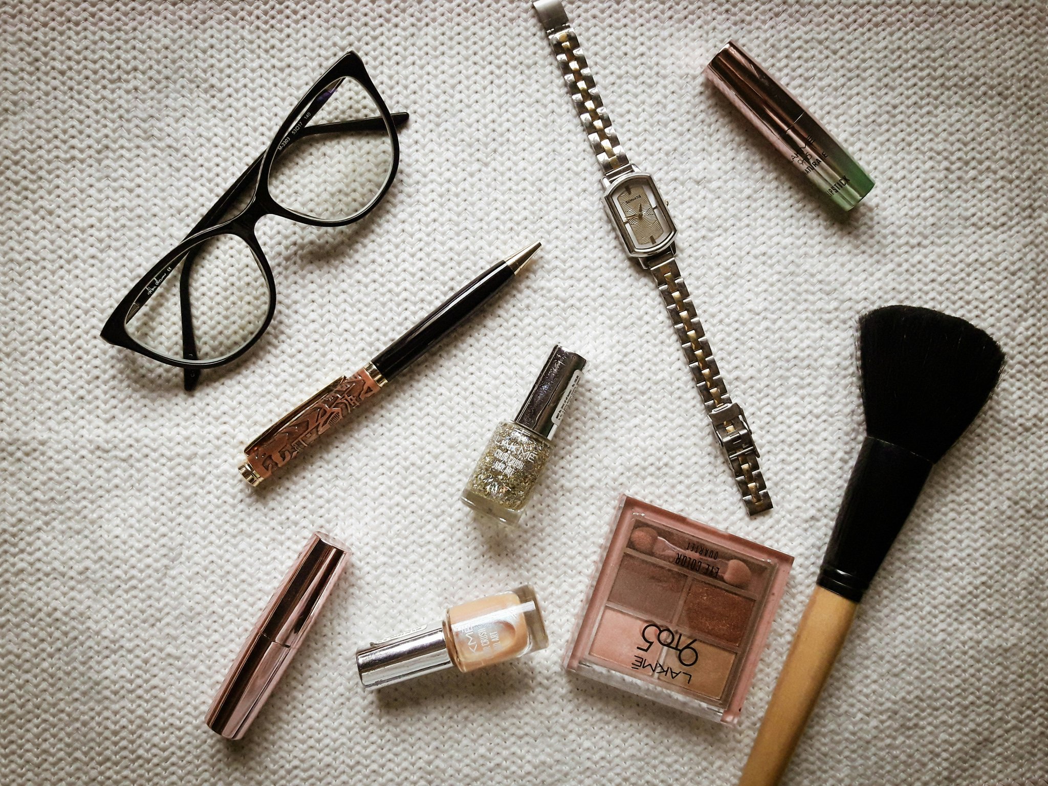 Close-up image showing various types of eyebrow brushes side by side