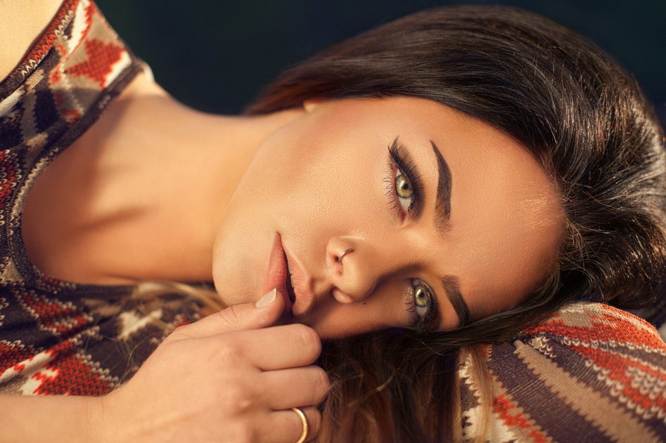 Eyebrow brush and beauty tools on a neutral background