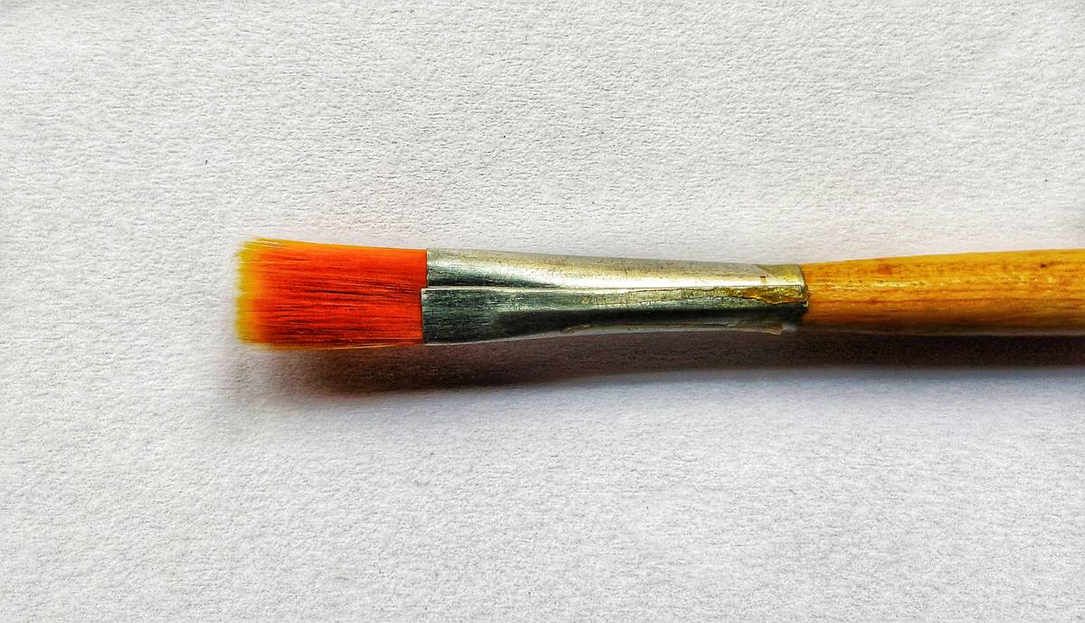 Different types of makeup brushes on a white background