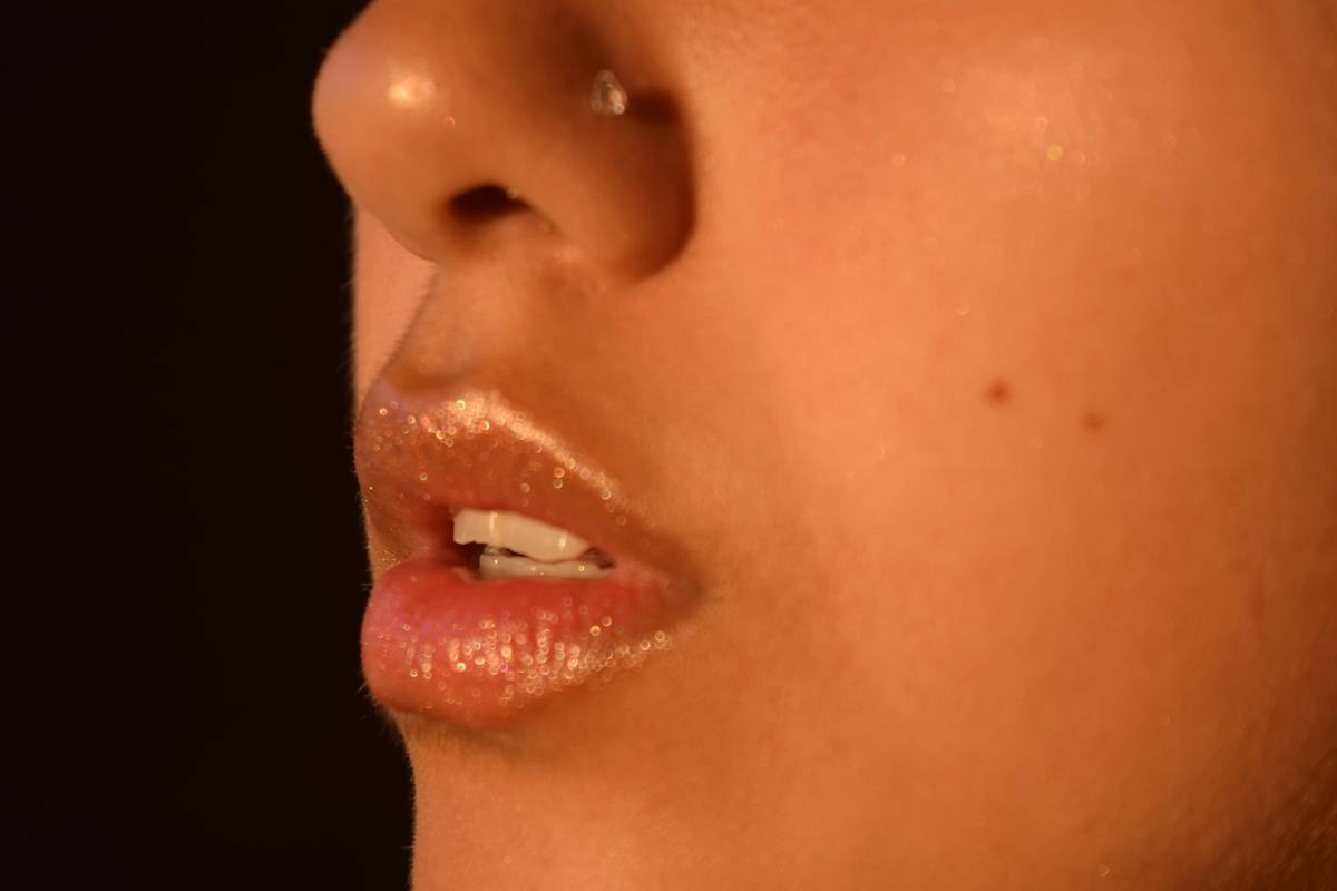 Woman holding an incorrect brush while attempting brow makeup