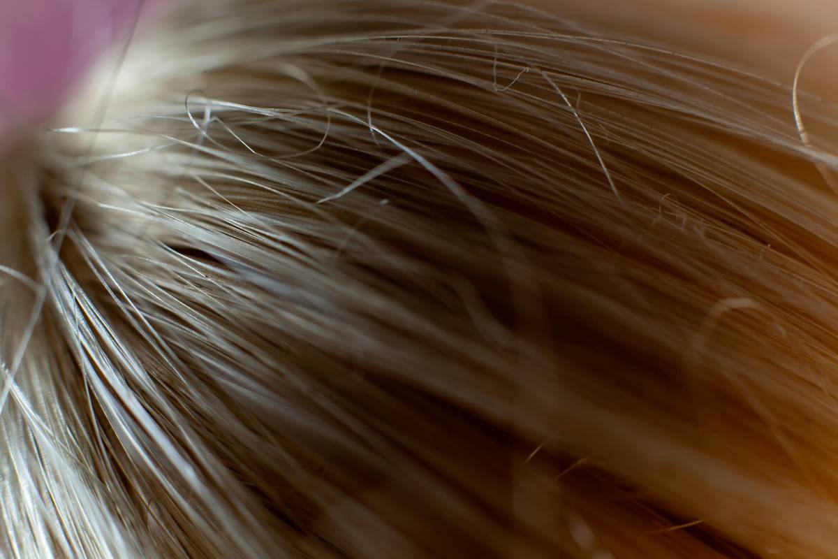 Close-up image of a high-quality eyebrow detailing comb made of natural boar bristles.