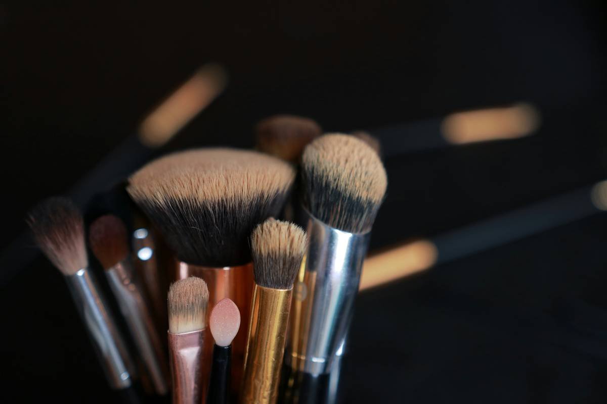 A high-quality image showing a variety of eyebrow brushes and their uses.